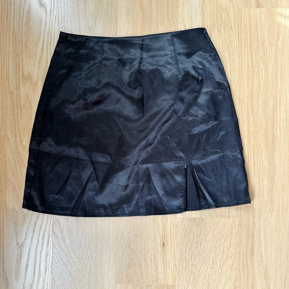 Stylish Black Women's Mini Skirt with front slit.